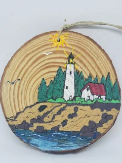 Lighthouse On Coast With Mountains Wood Ornament