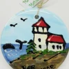 Lighthouse With Whale On Disc Ceramic Ornament